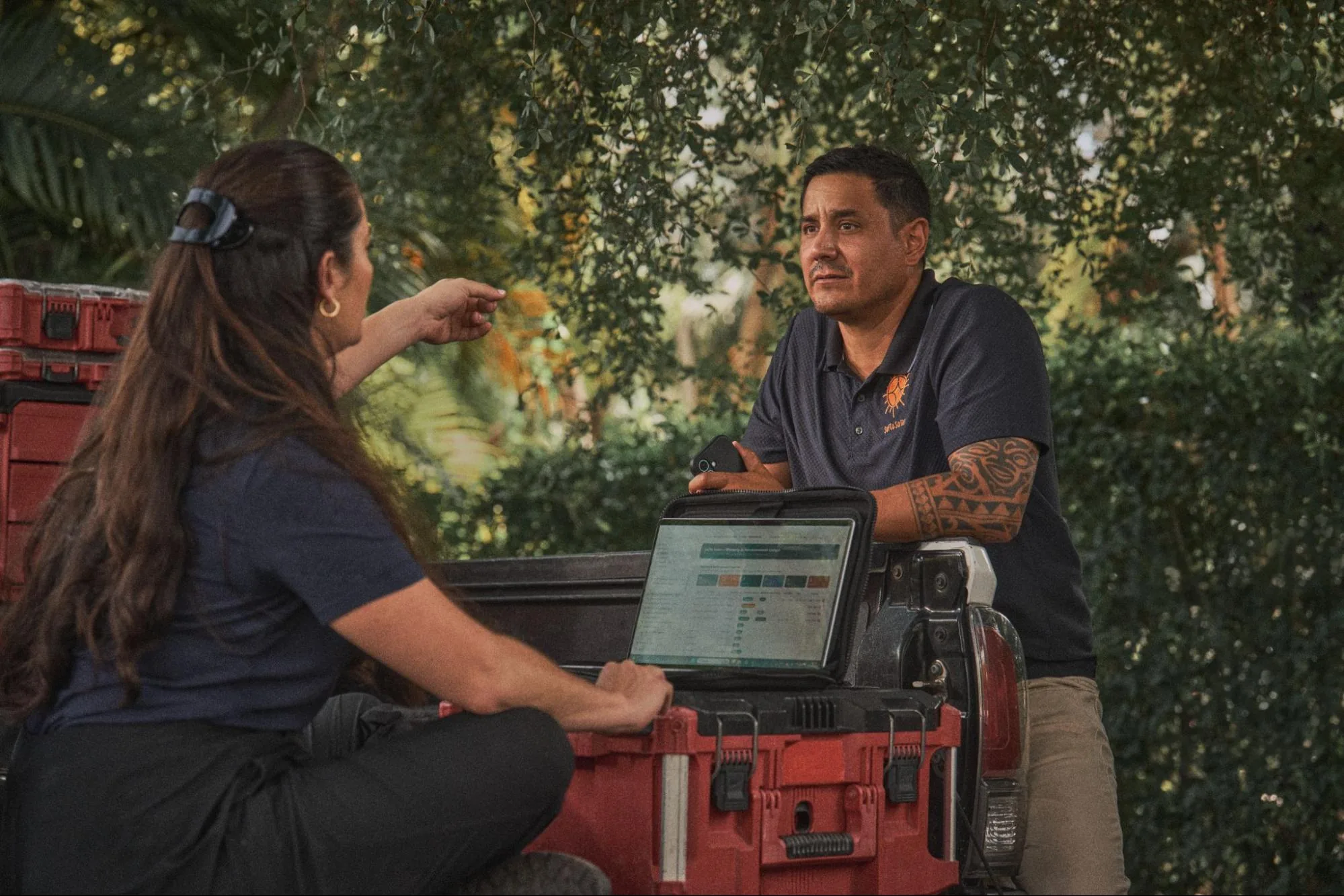 SolarSync founders standing beside a service truck