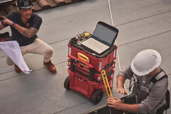 SolarSync crew reviewing a rooftop plan before a job